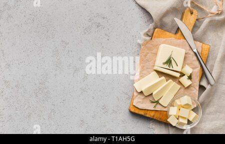 Block of butter on board Stock Photo