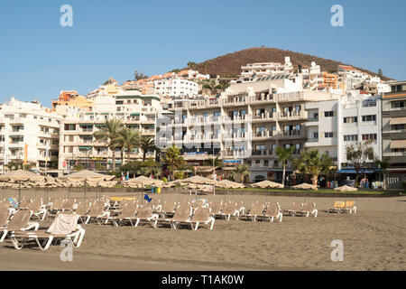Rows of empty sun loungers on the Playa de Los Cristianos, Arona, Tenerife, Canary Islands Stock Photo