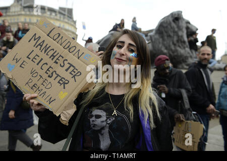 London, Greater London, UK. 23rd Mar, 2019. A protester seen holding a placard that says 'Manchester, Leicester we voted remain'' during the protest.Over a million people marched peacefully in central London in favor of a second referendum. People gathered at Park Lane to rally at Parliament Square to demonstrate against the Tory government's Brexit negotiations, and to demand a second vote on the final Brexit deal. March was organized by The Peoples Vote. Credit: Andres Pantoja/SOPA Images/ZUMA Wire/Alamy Live News Stock Photo