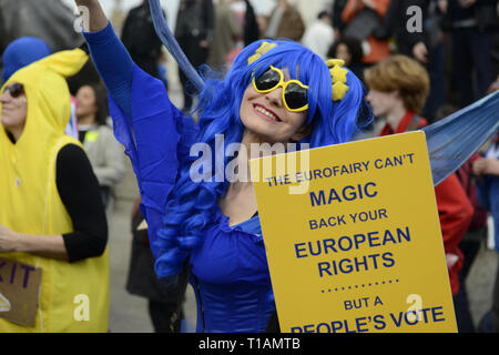 London, Greater London, UK. 23rd Mar, 2019. A woman seen wearing a fairy godmother costume seen holding a placard that says ' The Eurofairy can't magic back your european rights but a people's vote yes, during the protest.Over a million people marched peacefully in central London in favor of a second referendum. People gathered at Park Lane to rally at Parliament Square to demonstrate against the Tory government's Brexit negotiations, and to demand a second vote on the final Brexit deal. March was organized by The Peoples Vote. (Credit Image: © Andres Pantoja/SOPA Images Stock Photo