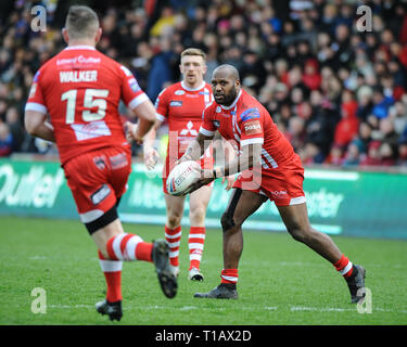 Salford, UK. , . 24 March 2019. AJ Bell Stadium, Salford, England; Rugby League Betfred Super League, Salford Red Devils vs Wigan Warriors; Salford Red Devils Robert Lui launches Adam Walker into attack. Credit: Dean Williams/Alamy Live News