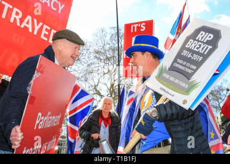 Westminster, London, UK, 25th Mar 2019. Pro- and Anti-Brexit protesters chant and rant at each other outside the Houses of Parliament in Westminster, on another turbulent day of political uncertainty around Brexit. Credit: Imageplotter/Alamy Live News Stock Photo