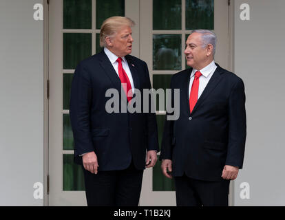 Washington, USA. 25th Mar 2019. United States President Donald J. Trump chats with the Prime Minister of Israel, Benjamin Netanyahu before holding a meeting at the White House in Washington, DC, March 25, 2019. Credit: Chris Kleponis/CNP | usage worldwide Credit: dpa picture alliance/Alamy Live News Credit: dpa/Alamy Live News Stock Photo