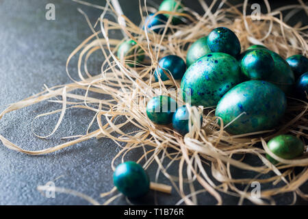 Easter background with painted Easter eggs in vintage style over dark background Stock Photo
