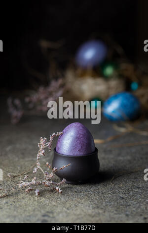 Easter background with painted Easter eggs in vintage style over dark background Stock Photo