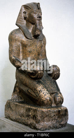 Amenhotep II (c.1436-c.1413 BC). Egyptian Pharaoh (1428-1401 BC). 18th Dynasty. New Kingdom. Granite statue of the Pharaoh offering two glasses of wine to a divinity. From the Temple of Karnak, Egypt. Egyptian Museum. Turin. Italy. Stock Photo