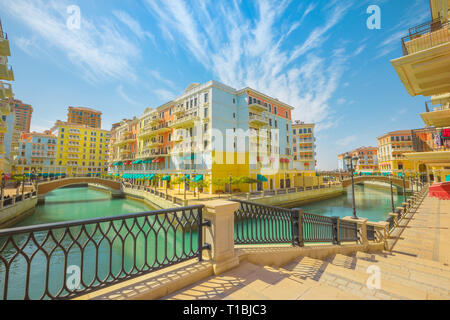 Little Venice with canals connected by bridges in venetian style. Colorful houses in picturesque Qanat Quartier icon of Doha, Qatar at daylight Stock Photo