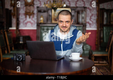 Man blogger telling something to his audience in camera Stock Photo
