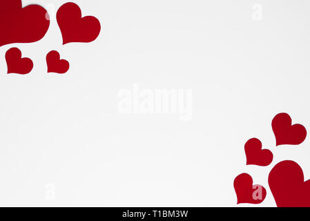 Romantic and simple frame arranged from red hearts on white background ...