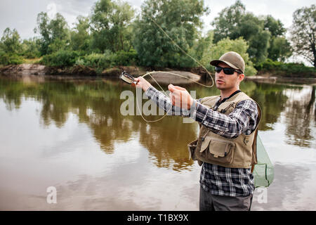 picture of pike in a fish net, European pike caught in spinning, fishing  predator fish, spinning fishing Stock Photo - Alamy