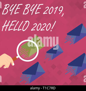 Word writing text Bye Bye 2019 Hello 2020. Business photo showcasing saying goodbye to last year and welcoming another good one Magnifying Glass on On Stock Photo