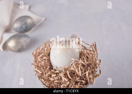 Easter eggs on the table with feather Stock Photo