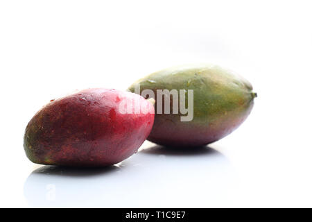 Mango.Mature, exotic, tropical mango fruit on a white background. Stock Photo