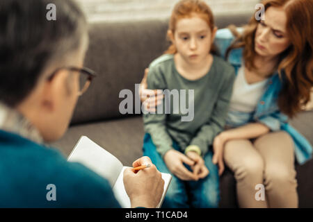 Selective focus of a doctor taking notes Stock Photo