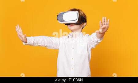 Preteen boy using virtual reality headset and gesturing Stock Photo