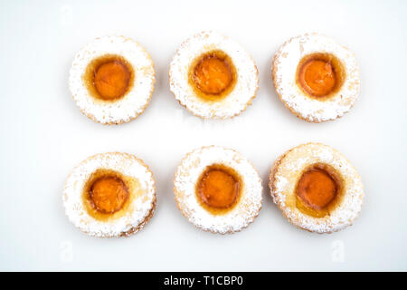 round pastries of pastry and jam on a white surface Stock Photo