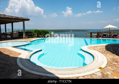 Swimming pool, with view of Kazinga Channel, at Mweya Safari Lodge within Queen Elizabeth National Park in South West Uganda, East Africa Stock Photo