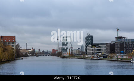 Berlin, Germany- December 12, 2018: view of the Berlin Wall and Television Tower from the Oberbaunum bridge, Spree river in winter day Stock Photo