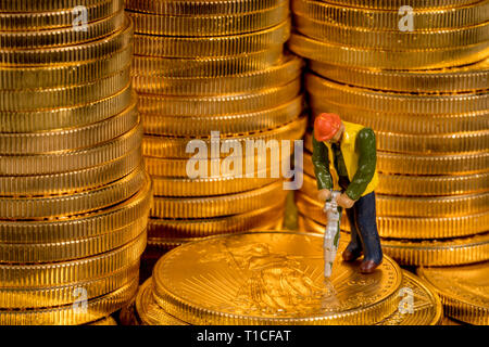 Concept of mining of gold with US Treasury Gold Eagle coins Stock Photo