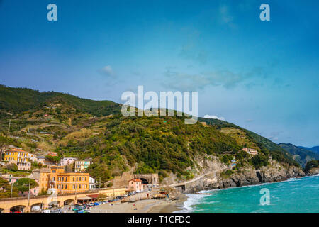 Scenic view of ocean and harbor in colorful village Monterosso, Cinque Terre national park, Liguria, Italy. Its one of five famous picturesque. Stock Photo