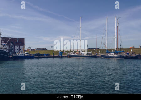 Oudeschild,Texel, The Netherlands, October 13, 2018: boats at the bay in Oudeschild on sunny autumn day Stock Photo