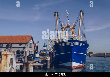 Texel, The Netherlands, October 13, 2018: fishing trawler moored near Restaurant De Kombuis at Oudeschild  port Stock Photo