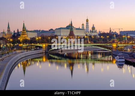 Morning city landscape with view on Moscow Kremlin and reflections in water of river. Stock Photo