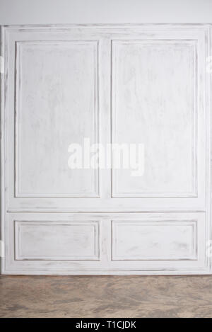 Empty interior with white wall panels and concrete floor Stock Photo