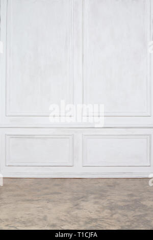 Empty interior with white wall panels and concrete floor Stock Photo