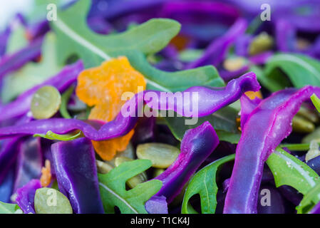 salad with red cabbage and arugula leaves macro Stock Photo