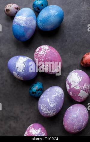 Colorful Easter chicken eggs on dark background. Concept of Easter painted eggs Stock Photo