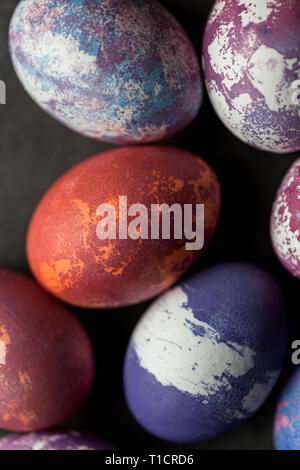Colorful Easter eggs on dark background. Concept of Easter painted eggs Stock Photo