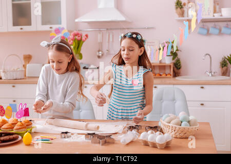 Two best friends preparing cookies for fest Stock Photo