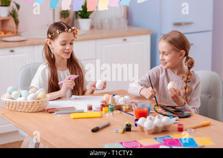 Friendly sisters spending weekend together at home Stock Photo