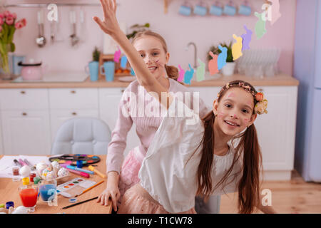 Joyful teenagers having fun together in the kitchen Stock Photo