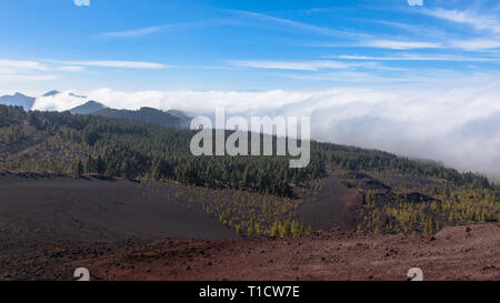 Remarkable ornographic waterfall clouds spilling over the leeward slope of mountains on northern Tenerife. Stock Photo