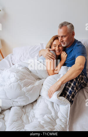 Businessmen feeling relaxed chilling in bed in the morning Stock Photo