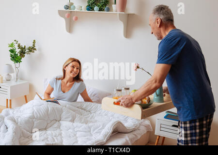 Wife feeling really happy having caring husband taking care of her Stock Photo