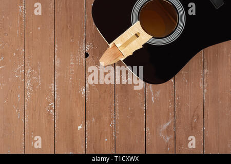 Guitar repair and service - broken sound board acoustic guitar top view wooden background Stock Photo