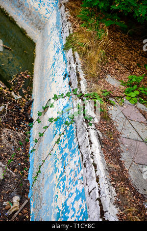 Broken blue azure  retro tiles mosaic in abandoned pool - Berengaria Hotel, Cyprus Stock Photo