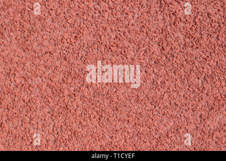Red rubber running track, seamless rubber grain texture background, rubberize ground save runner when run, red grain texture on running track, texture Stock Photo