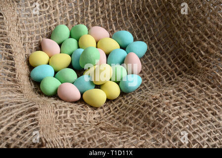 Closeup easter candy eggs in nest Stock Photo