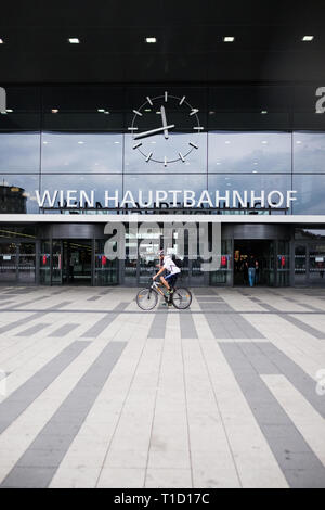 Wien Hauptbahnhof, the Vienna main train station, with a cyclist in front and room for text. Stock Photo