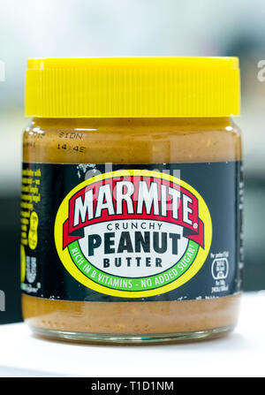 Jar of Marmite Crunchy Peanut Butter, The original Marmite is made by Unilever and first launched in 1902. Stock Photo