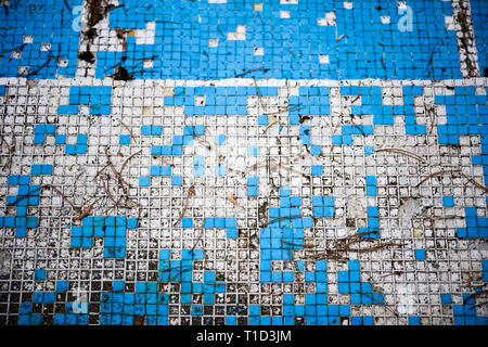 Broken blue azure  retro tiles mosaic in abandoned pool - Berengaria Hotel, Cyprus Stock Photo