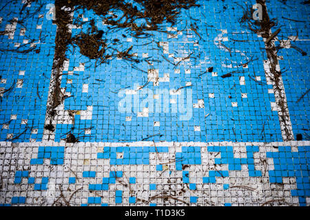 Broken blue azure  retro tiles mosaic in abandoned pool - Berengaria Hotel, Cyprus Stock Photo