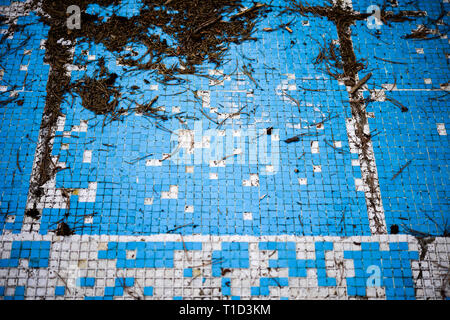 Broken blue azure  retro tiles mosaic in abandoned pool - Berengaria Hotel, Cyprus Stock Photo
