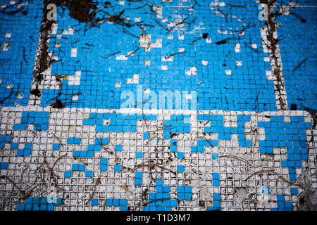 Broken blue azure  retro tiles mosaic in abandoned pool - Berengaria Hotel, Cyprus Stock Photo