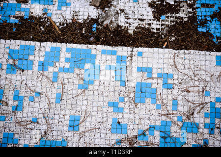 Broken blue azure  retro tiles mosaic in abandoned pool - Berengaria Hotel, Cyprus Stock Photo
