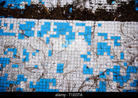 Broken blue azure  retro tiles mosaic in abandoned pool - Berengaria Hotel, Cyprus Stock Photo